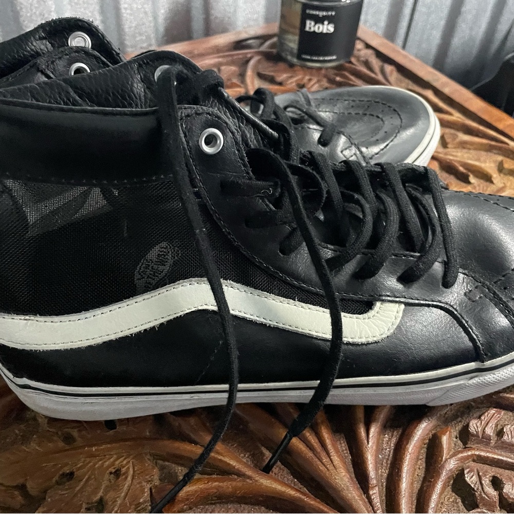 Vans Black and White Athletic Shoes with Classic High-Top Design